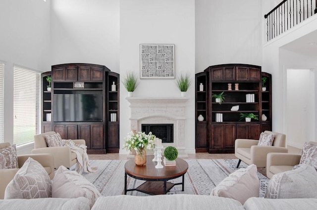 11307 Bentgrove Ln, Cypress, TX 77433 - living room featuring a towering ceiling and a premium fireplace