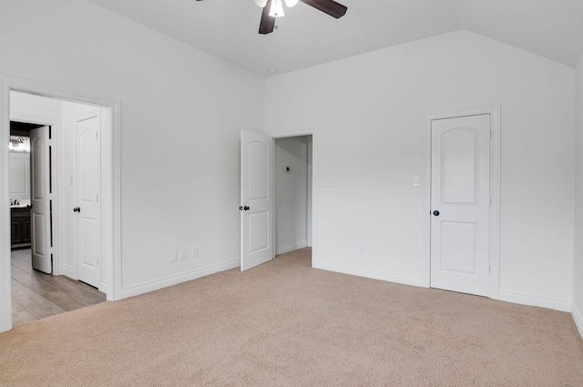 11307 Bentgrove Ln, Cypress, TX 77433 - unfurnished bedroom featuring light carpet, lofted ceiling, connected bathroom, baseboards, and a ceiling fan