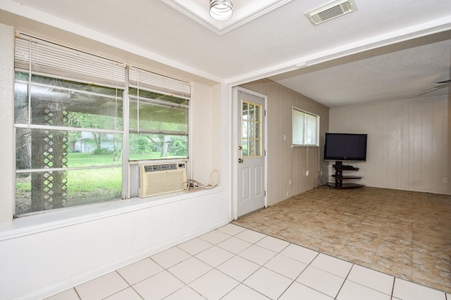 12618 Foxburo Dr, Houston, TX 77065 - foyer featuring wood walls and cooling unit