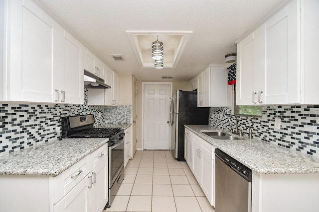 12618 Foxburo Dr, Houston, TX 77065 - kitchen featuring stainless steel appliances, a sink, under cabinet range hood, white cabinets, and light tile patterned floors