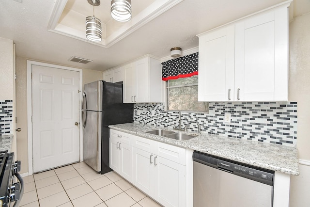 12618 Foxburo Dr, Houston, TX 77065 - kitchen featuring stainless steel appliances, a sink, and white cabinetry