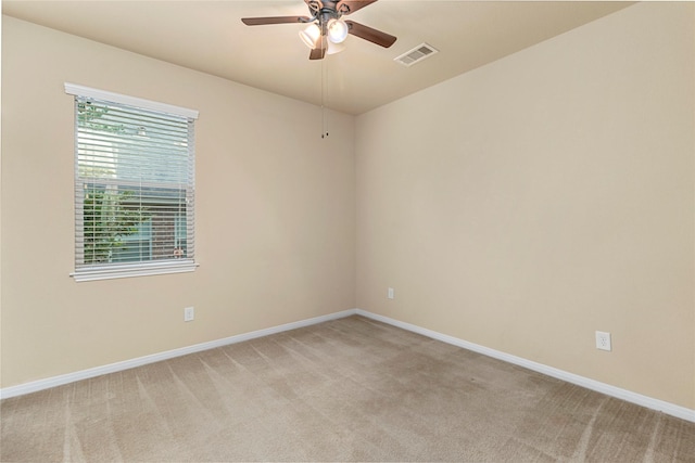1938 Honey Laurel Dr, Conroe, TX 77304 - unfurnished room featuring light colored carpet, a ceiling fan, and baseboards