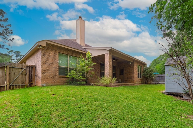 1938 Honey Laurel Dr, Conroe, TX 77304 - rear view of house with brick siding, ceiling fan, and a chimney