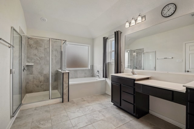 9001 Cimarron River Ln, Magnolia, TX 77354 - full bath featuring vanity, a stall shower, a bath, lofted ceiling, and tile patterned flooring