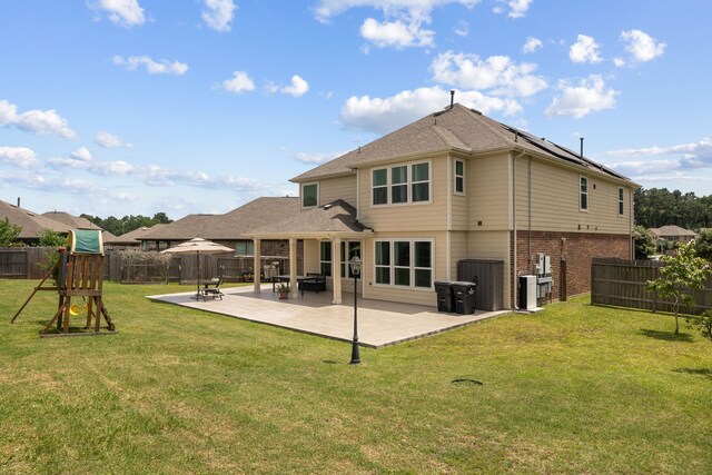 9001 Cimarron River Ln, Magnolia, TX 77354 - back of house with a patio area, brick siding, solar panels, and roof with shingles