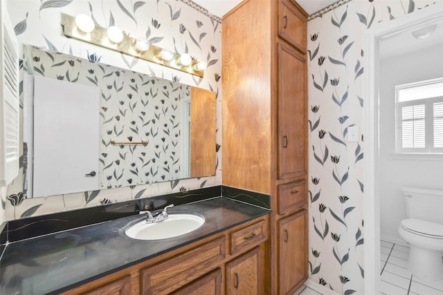 12939 Westhorpe Dr, Houston, TX 77077 - bathroom with toilet, vanity, and tile patterned floors
