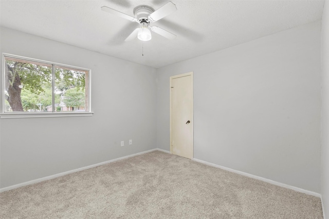 12939 Westhorpe Dr, Houston, TX 77077 - carpeted empty room featuring baseboards and ceiling fan
