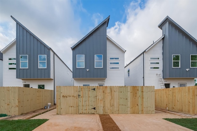 2706 Bostic St, Houston, TX 77093 - back of property with board and batten siding, fence, and a gate