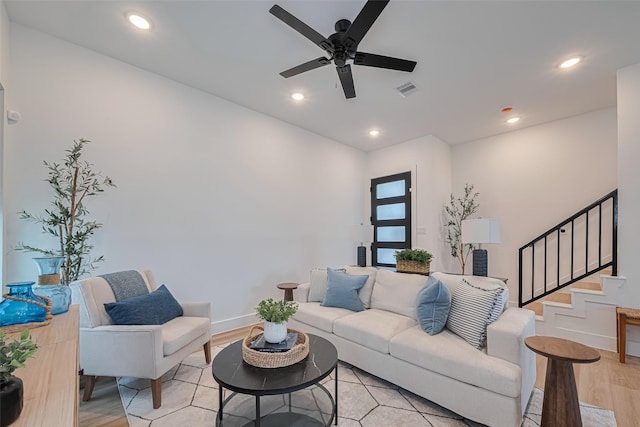 2706 Bostic St, Houston, TX 77093 - living room featuring light wood finished floors, stairway, ceiling fan, recessed lighting, and baseboards