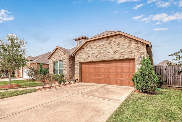 8107 Silverspot Ln, Missouri City, TX 77459 - view of front of home with brick siding, an attached garage, and concrete driveway