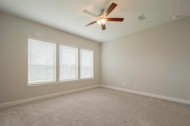 8107 Silverspot Ln, Missouri City, TX 77459 - unfurnished room with ceiling fan, light carpet, baseboards, and a smoke detector