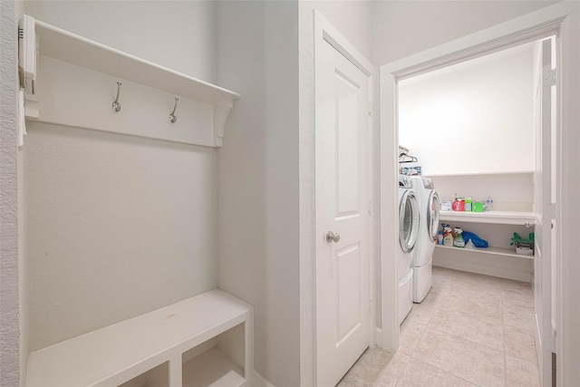 8107 Silverspot Ln, Missouri City, TX 77459 - washroom featuring washer and dryer and light tile patterned floors