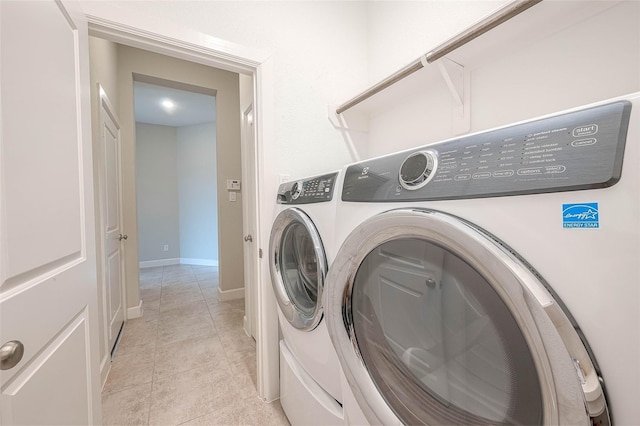 8107 Silverspot Ln, Missouri City, TX 77459 - laundry room with independent washer and dryer and light tile patterned floors