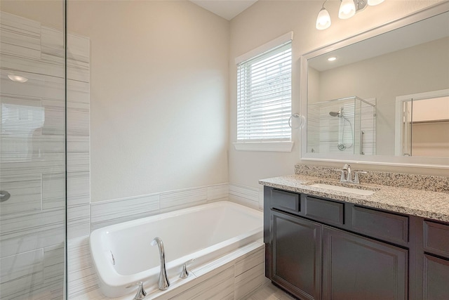 8107 Silverspot Ln, Missouri City, TX 77459 - full bath featuring a stall shower, a bath, and vanity
