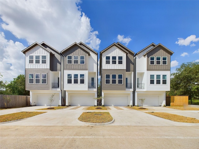 6834 Lozier St, Houston, TX 77021 - view of front of property with board and batten siding, a garage, and concrete driveway