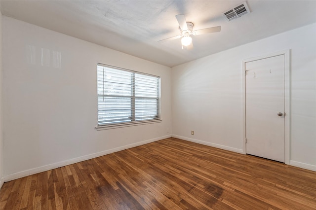 2910 John St, La Marque, TX 77568 - empty room featuring baseboards, hardwood / wood-style flooring, and ceiling fan