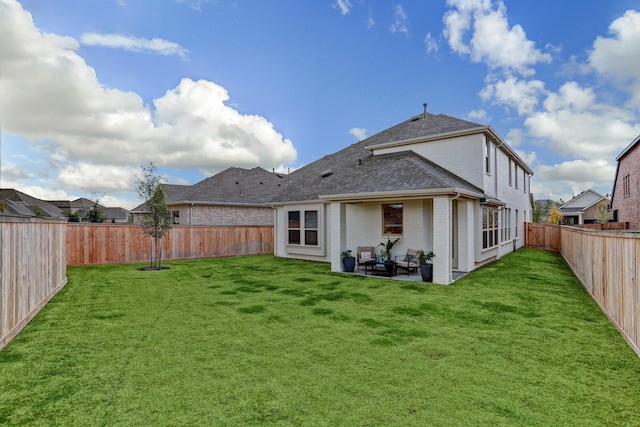 20923 Grand Surprise Ct, Cypress, TX 77433 - rear view of house featuring brick siding, a patio area, and roof with shingles