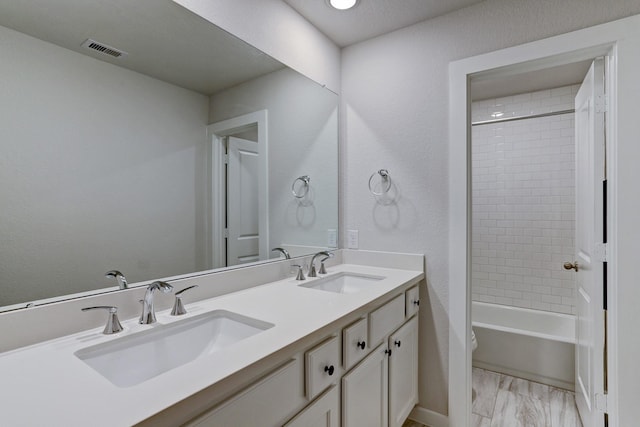 20923 Grand Surprise Ct, Cypress, TX 77433 - bathroom with double vanity, toilet, marble finish flooring, and shower / bath combination