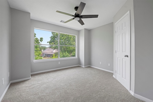 18438 Brenwood Manor Dr, Katy, TX 77449 - empty room featuring carpet flooring, a ceiling fan, and baseboards