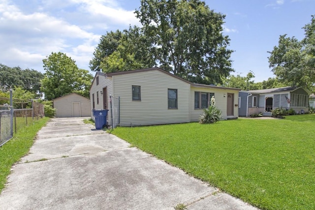1202 13th St N, Texas City, TX 77590 - view of front of house featuring a garage, an outbuilding, and concrete driveway