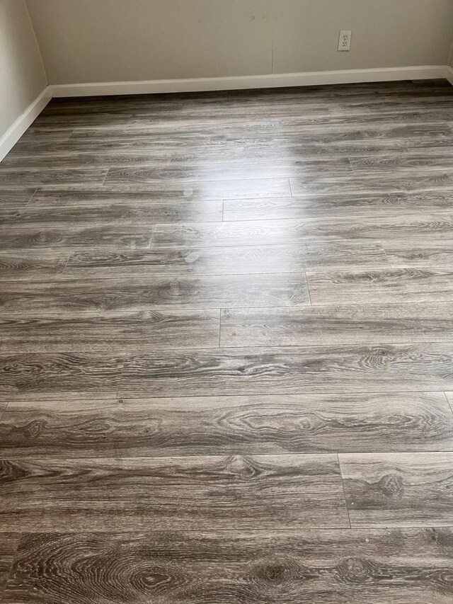 1202 13th St N, Texas City, TX 77590 - detailed view of wood finished floors and baseboards