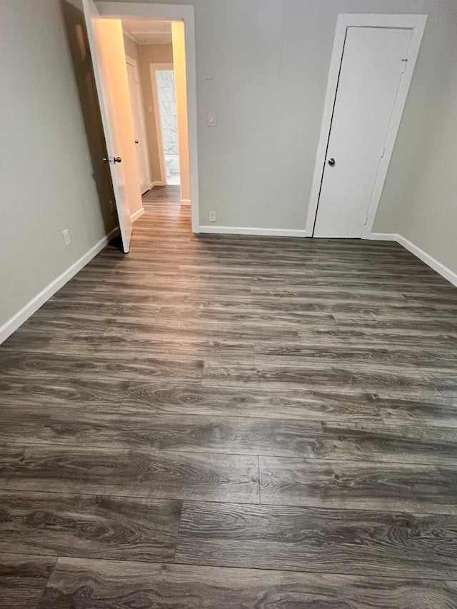 1202 13th St N, Texas City, TX 77590 - spare room with dark wood-type flooring and baseboards