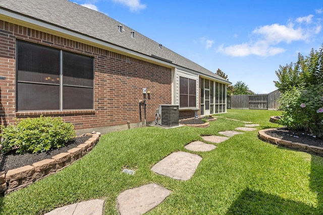 16506 Shimmering Lake Dr, Cypress, TX 77433 - view of yard featuring central AC unit and a sunroom