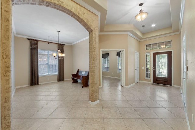16506 Shimmering Lake Dr, Cypress, TX 77433 - entrance foyer featuring a chandelier, healthy amount of natural light, baseboards, ornamental molding, and light tile patterned floors