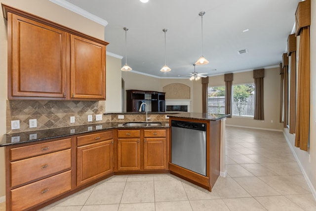 16506 Shimmering Lake Dr, Cypress, TX 77433 - kitchen featuring stainless steel dishwasher, a sink, light tile patterned floors, brown cabinets, and crown molding