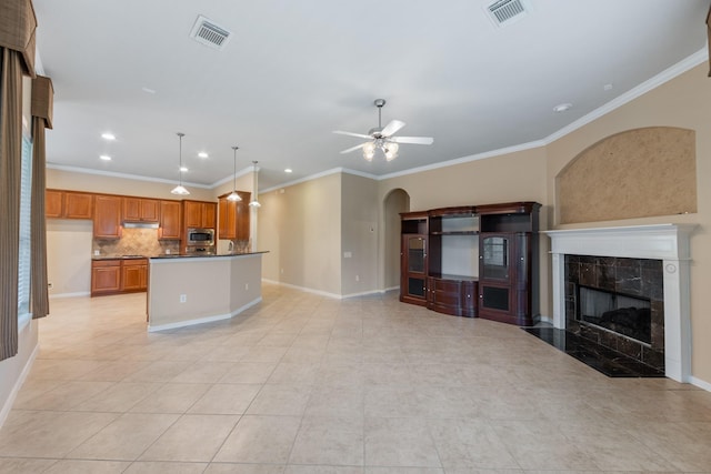 16506 Shimmering Lake Dr, Cypress, TX 77433 - unfurnished living room featuring ornamental molding, light tile patterned floors, ceiling fan, a fireplace, and baseboards