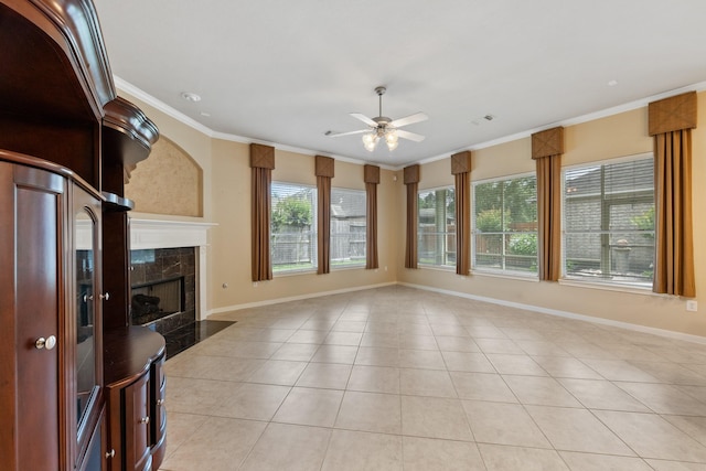 16506 Shimmering Lake Dr, Cypress, TX 77433 - unfurnished living room featuring a ceiling fan, ornamental molding, light tile patterned floors, baseboards, and a high end fireplace