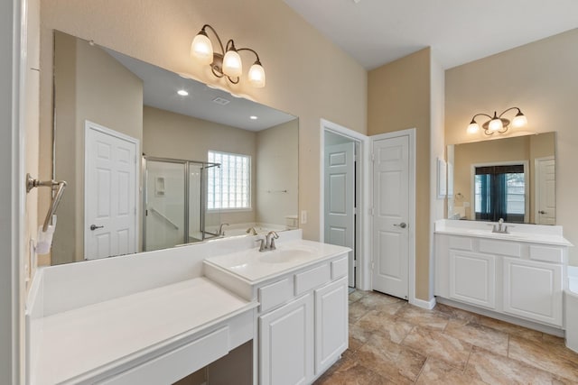 16506 Shimmering Lake Dr, Cypress, TX 77433 - bathroom with a shower stall, a bath, and two vanities