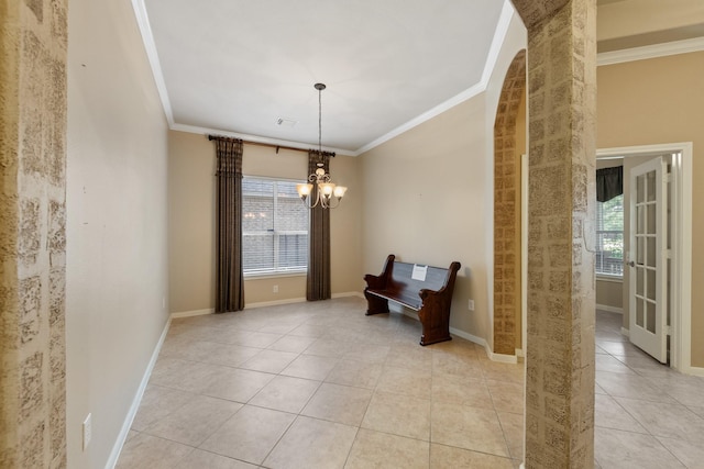 16506 Shimmering Lake Dr, Cypress, TX 77433 - unfurnished room featuring crown molding, healthy amount of natural light, light tile patterned floors, a chandelier, and baseboards