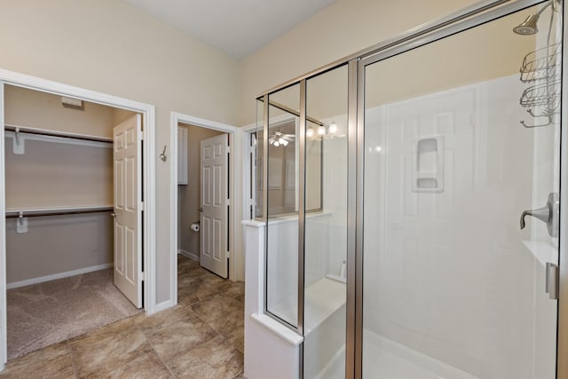 16506 Shimmering Lake Dr, Cypress, TX 77433 - full bath with a stall shower, a spacious closet, and baseboards