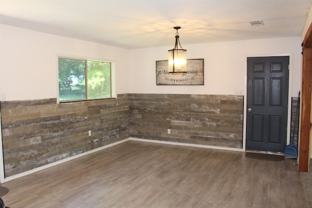 1314 Hooks St, Crockett, TX 75835 - unfurnished dining area featuring wood finished floors and baseboards