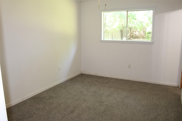 1314 Hooks St, Crockett, TX 75835 - spare room featuring carpet and baseboards