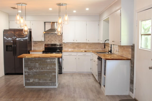 1314 Hooks St, Crockett, TX 75835 - kitchen with refrigerator with ice dispenser, wall chimney exhaust hood, butcher block countertops, stainless steel electric stove, and a sink
