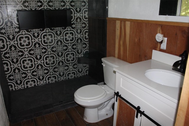1314 Hooks St, Crockett, TX 75835 - bathroom with vanity, toilet, and wood finished floors