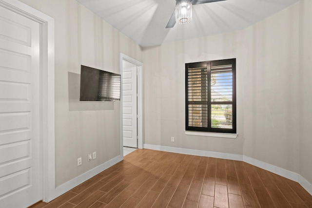 10630 Hazel Hills Dr, Cypress, TX 77433 - unfurnished bedroom featuring baseboards, dark wood-type flooring, and a ceiling fan