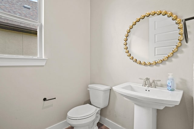 10630 Hazel Hills Dr, Cypress, TX 77433 - bathroom featuring baseboards, toilet, and wood finished floors