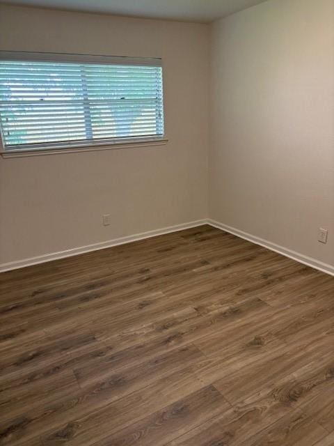 3213 Whitesail Dr, League City, TX 77573 - unfurnished room featuring dark wood-style flooring and baseboards