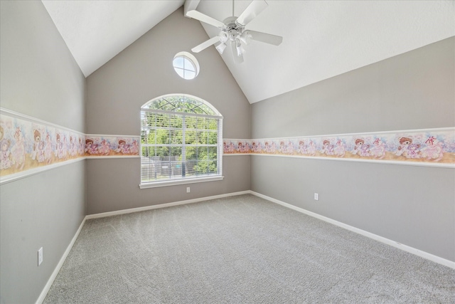 spare room featuring plenty of natural light, carpet, ceiling fan, baseboards, and high vaulted ceiling