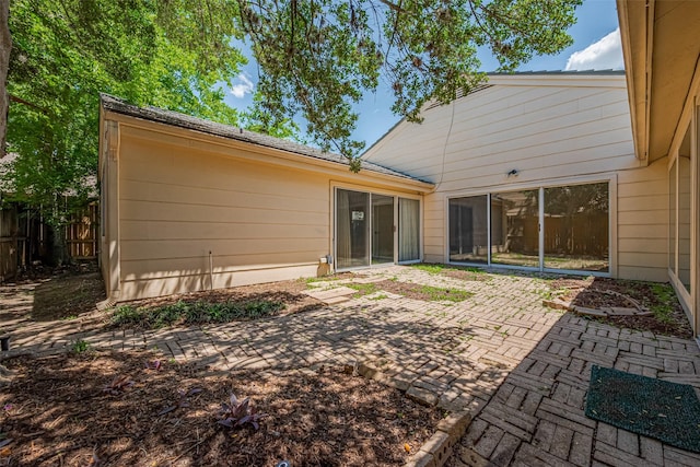 back of house featuring fence and a patio area
