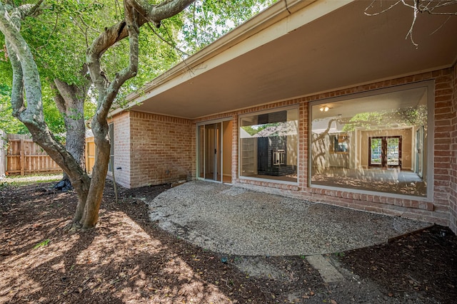 view of patio featuring fence