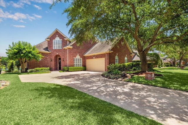 418 Brook Shore Ct, Sugar Land, TX 77478 - traditional home featuring brick siding, an attached garage, concrete driveway, a front yard, and roof with shingles