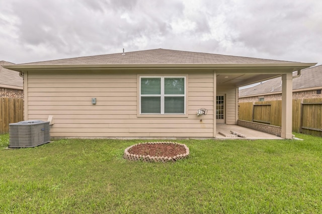 9526 Opal Gates Dr, Rosharon, TX 77583 - rear view of property with central air condition unit and a patio