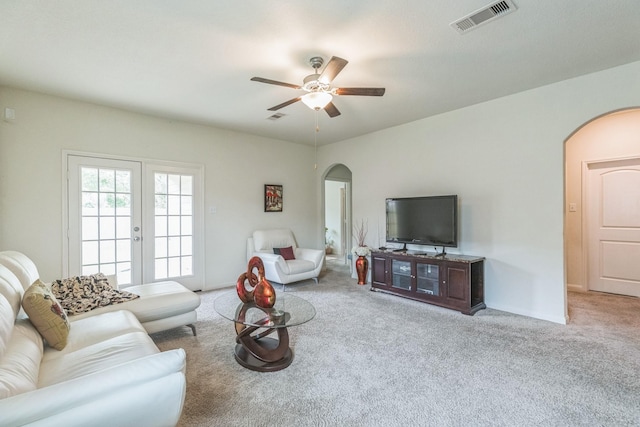 9526 Opal Gates Dr, Rosharon, TX 77583 - living room featuring arched walkways, carpet floors, and a ceiling fan