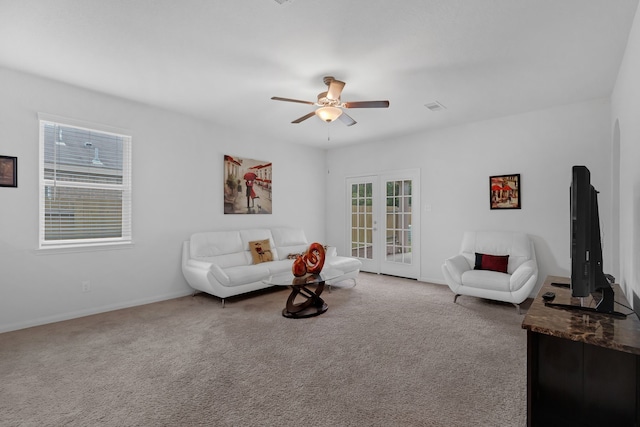 9526 Opal Gates Dr, Rosharon, TX 77583 - carpeted living room with a ceiling fan and baseboards