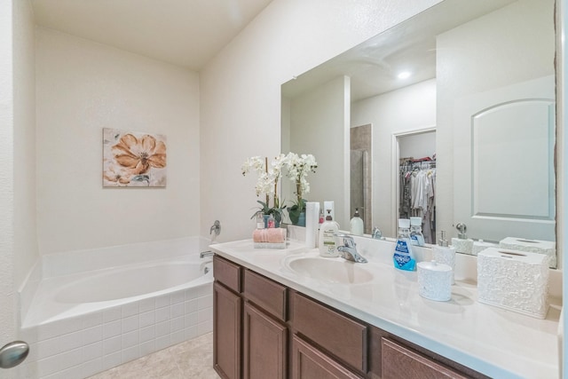 9526 Opal Gates Dr, Rosharon, TX 77583 - bathroom with a bath, a walk in closet, vanity, tile patterned floors, and a shower stall