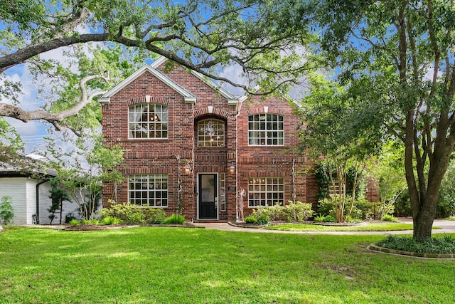 4510 Hazelton St, Houston, TX 77035 - traditional-style house with a front lawn and brick siding